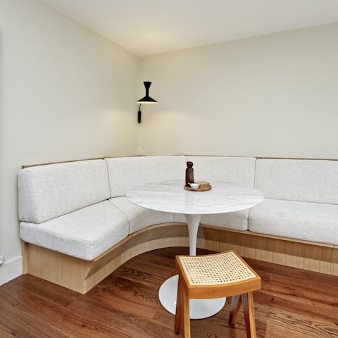 Settle down on the banquette and work from home