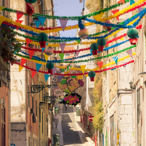 Wander the vibrant streets of Bairro Alto, a ten-minute walk away