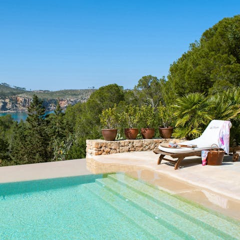 Lie back poolside and admire the sea views