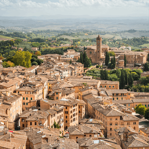 Stay in the Tuscan hills, an hour's drive from Siena