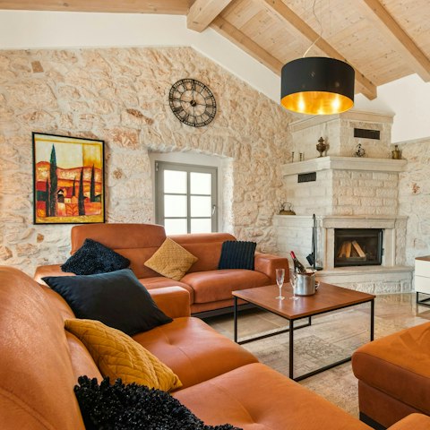 Get cosy in front of the living area's fireplace