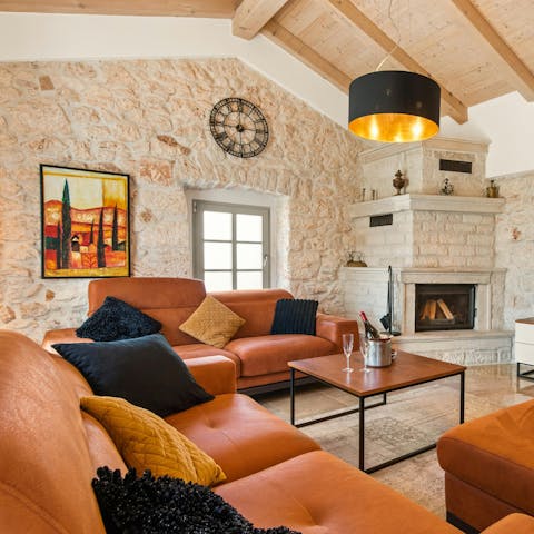 Get cosy in front of the living area's fireplace