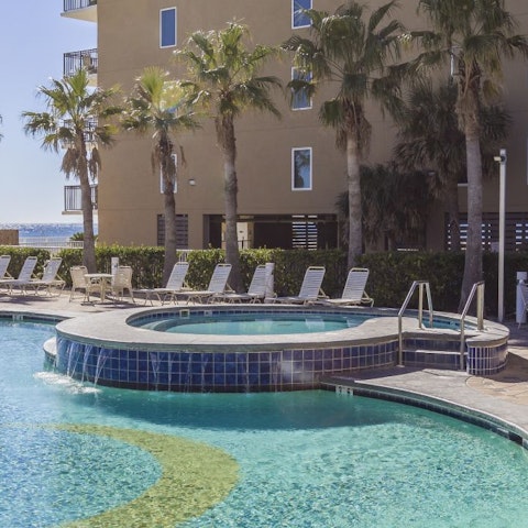Take a dip in the hot tub or splash about in the three communal pools