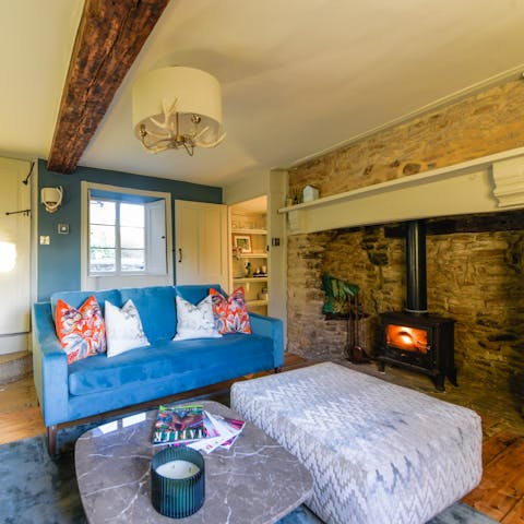 Cosy up by the wood burner with a good book and a glass of wine