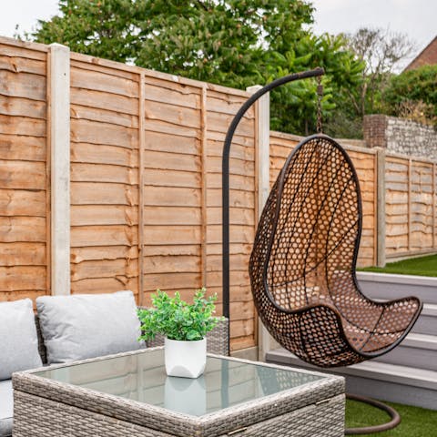 Swing the day away in the egg chair, a good book and a glass of wine in hand