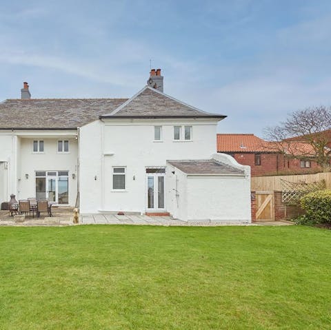 Watch the kids (and dogs) play in the huge back garden