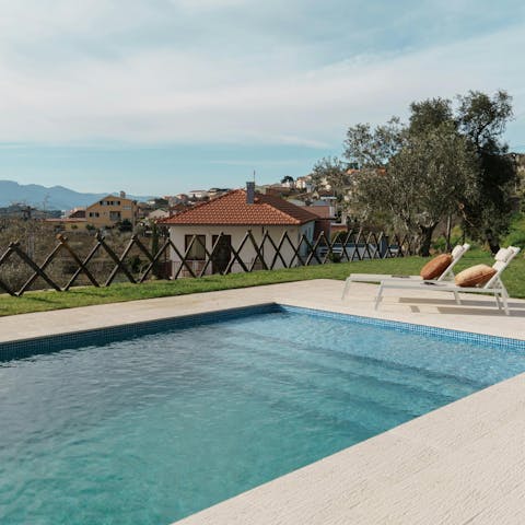 Swim in the pool while admiring the scenery