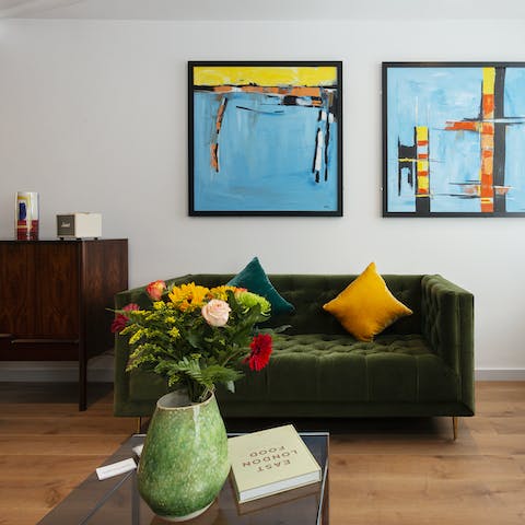 Mix a gin and tonic and get comfortable on the green velvet sofa for a relaxed night in