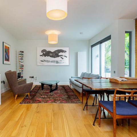 Relax in the bright living area with a glass of wine before sitting down to a meal at the window-side table