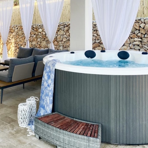 Sip a cold drink as you wind down in the bubbles of the hot tub