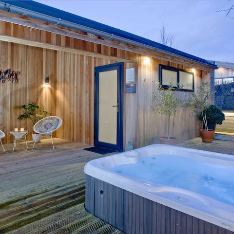 Sip cocktails under the sheltered, starlight roof before sinking into the hot tub for the evening