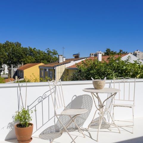 Enjoy quiet time on the sunny terrace while the others splash in the pool below