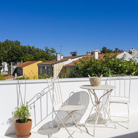 Enjoy quiet time on the sunny terrace while the others splash in the pool below