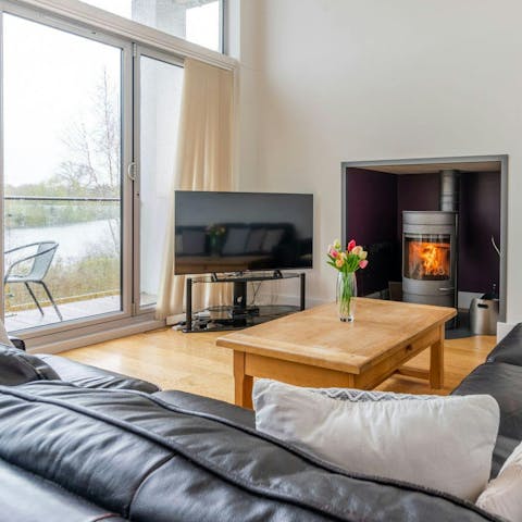 Enjoy views across the lake while relaxing by the fire