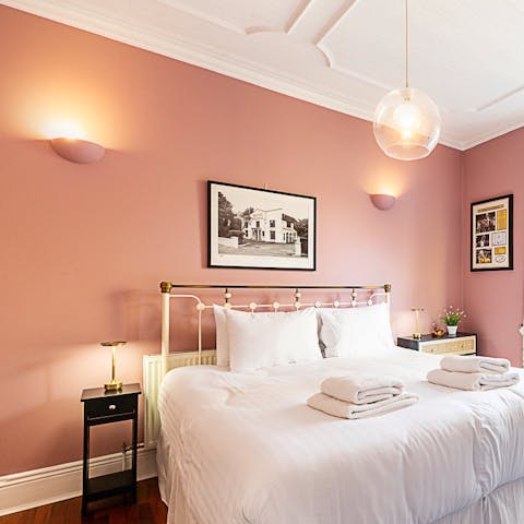 Drift off to sleep in the elegant king-sized bedroom