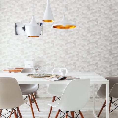 Flick through a magazine in the art deco-inspired living space