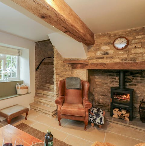Warm up by the log fire after a walk along the River Coln