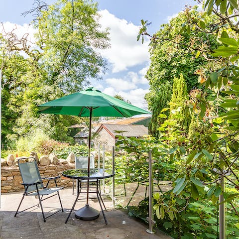 Sip drinks on your private riverside terrace, surrounded by greenery