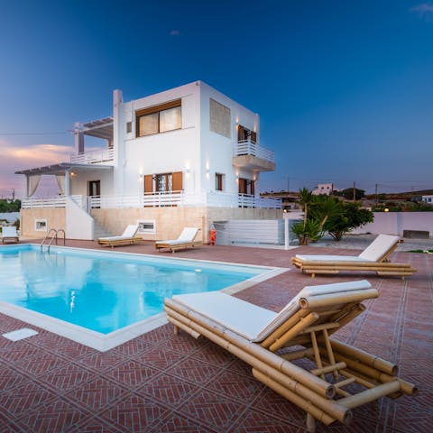 Relax on the loungers while the others make a splash in the swimming pool