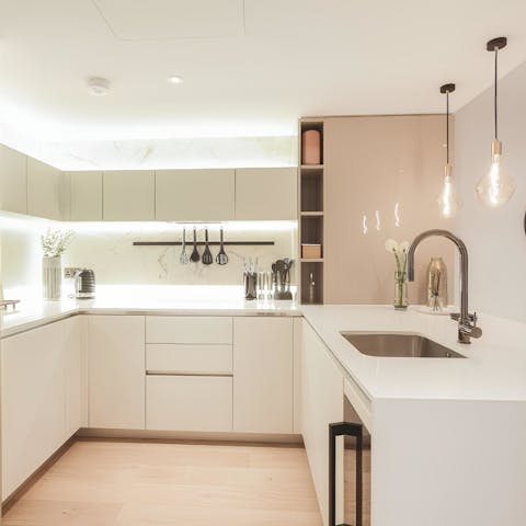 Set yourself up for a day in London with breakfast prepared in a sleek, modern kitchen