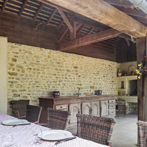 Fire up the barbecue in your summer kitchen and dine alfresco