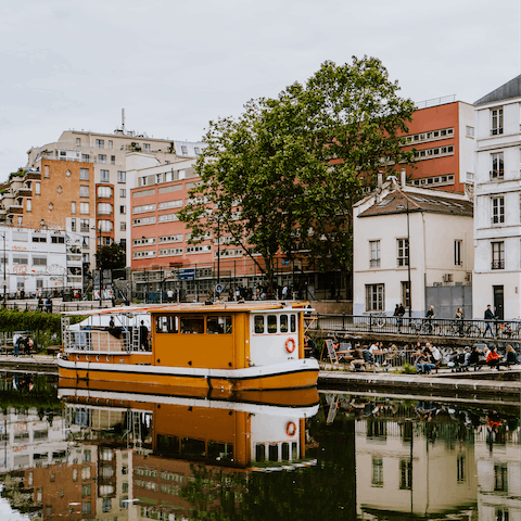 Have a romantic stroll along Canal Saint-Martin, a two-minute walk away