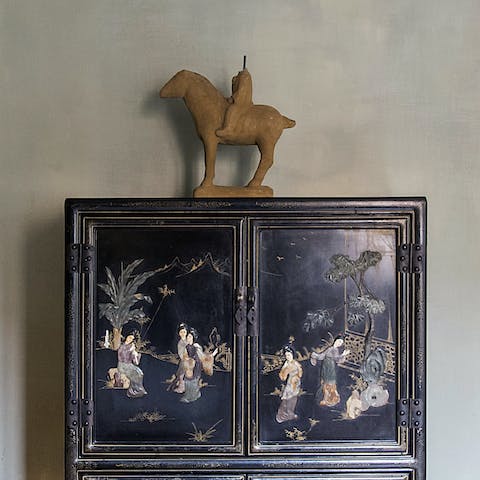 The antique cabinet in the master bedroom