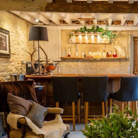 Unwind with a game of darts in the private pub