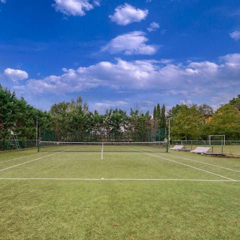 Work up a sweat playing tennis, volleyball, and football at this sporty home