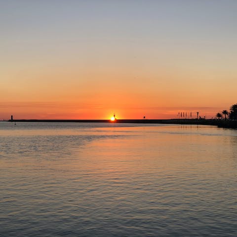 Watch the sunset at Benagil Beach, only a fifteen–minute walk away