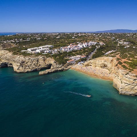 Visit Praia do Carvalho Beach, just an eight–minute walk away