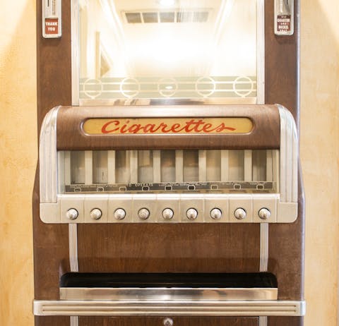 Admire the old cigarette dispenser