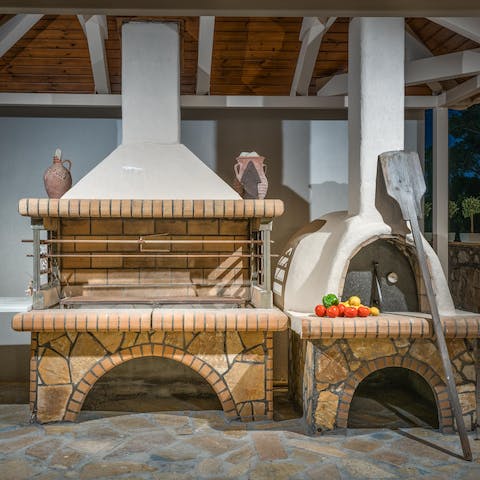 Try your hand at cooking souvlaki on the brick barbecue