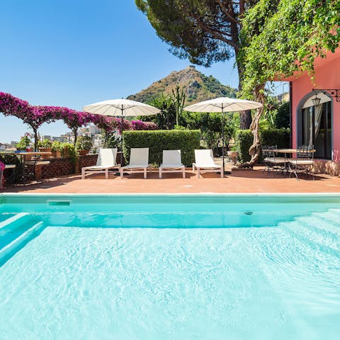 Soak up the Sicilian sun from beside the private pool