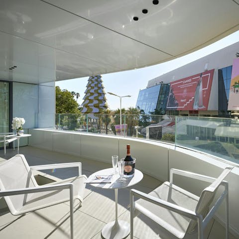 Admire the views of the Palace of Festivals from the balcony