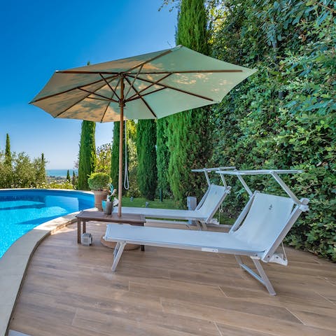 Settle back in a sun lounger with a book