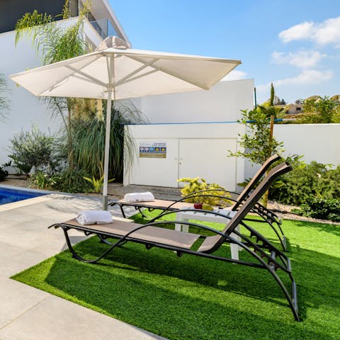 Soak up the Cypriot sun from the poolside loungers
