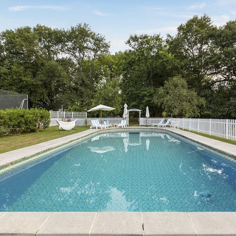 Float serenely in the swimming pool and listen to the breeze in the trees