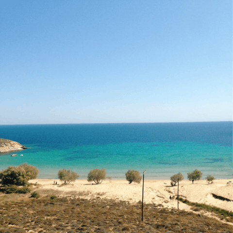 Sink your toes into the golden sand of Orkos beach, just 200m from your home-away-from-home