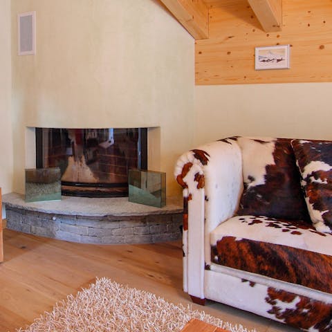 Cosy up by the fire in the comfortable living room