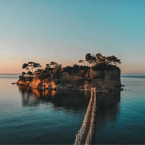 Walk across the wooden footbridge to Cameo Island, three kilometres away