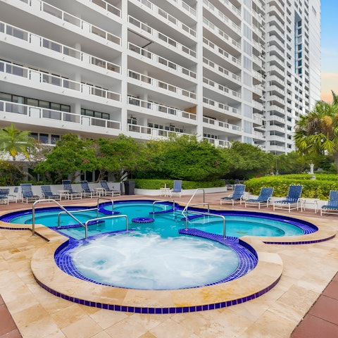 Relax and unwind in the shared hot tub