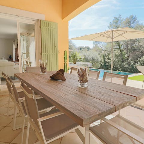 Enjoy meals alfresco on the covered patio