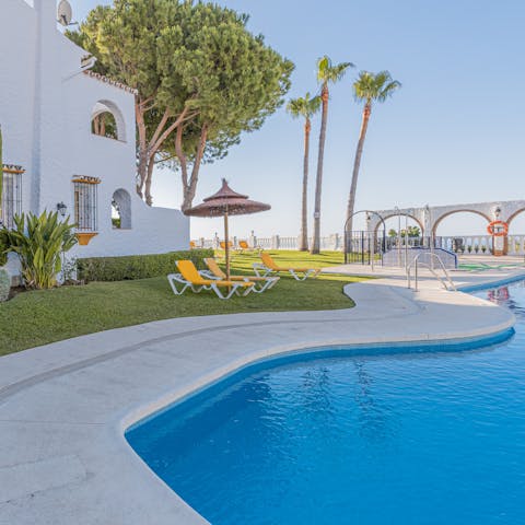 Relax by the communal outdoor pool or splash around in the sunshine