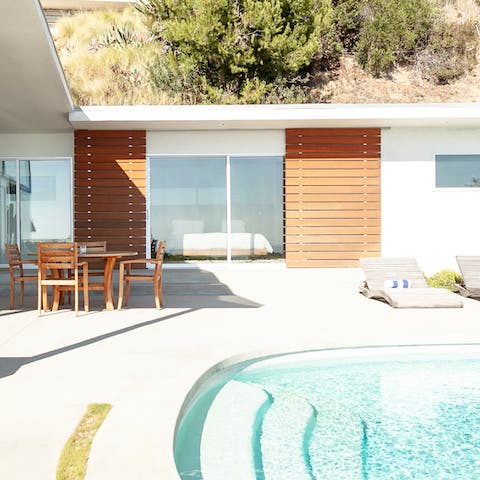 Hop straight out of bed and into the glittering pool