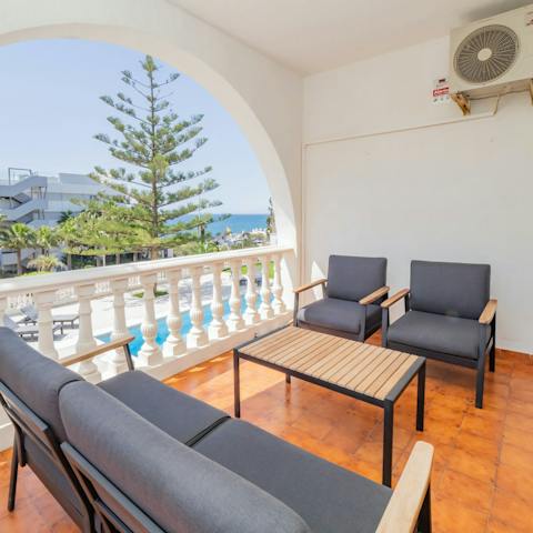Enjoy a few aperitifs on the balcony before heading out for dinner