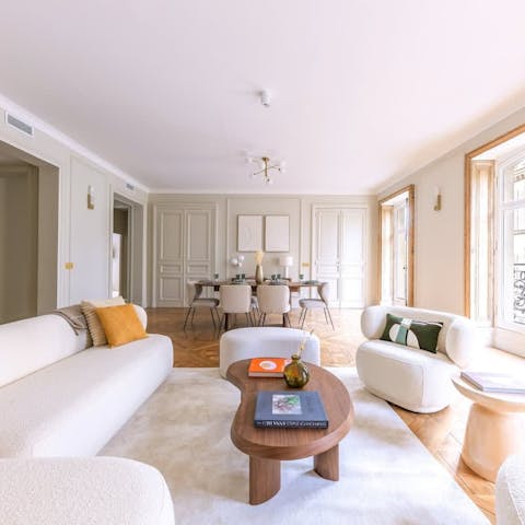 Relax in the light-filled living room with a glass of chilled Champagne