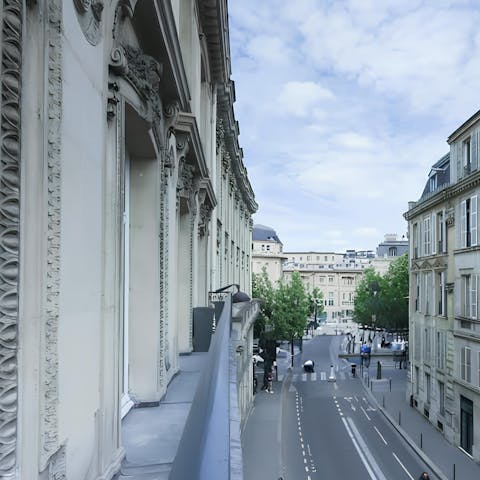 Take in the views of the Parisian architecture from the private balcony