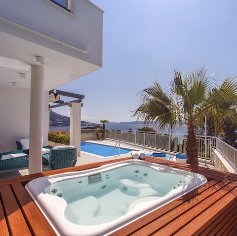 Sip a glass of something fruity in the private hot tub