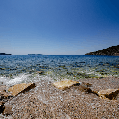 Slip on your sandals and stroll down to Vavlje Beach